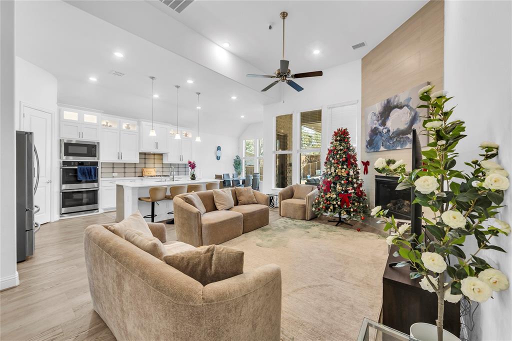 2218 Christopher Lane Euless, TX 76040 - Photo 8 of 28 a living room with furniture and a chandelier