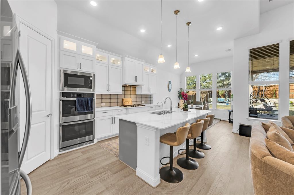 2218 Christopher Lane Euless, TX 76040 - Photo 9 of 28 a kitchen with a sink stainless steel appliances and counter space