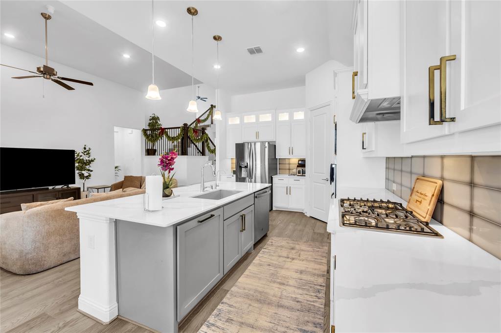 2218 Christopher Lane Euless, TX 76040 - Photo 10 of 28 a large kitchen with a sink and stainless steel appliances
