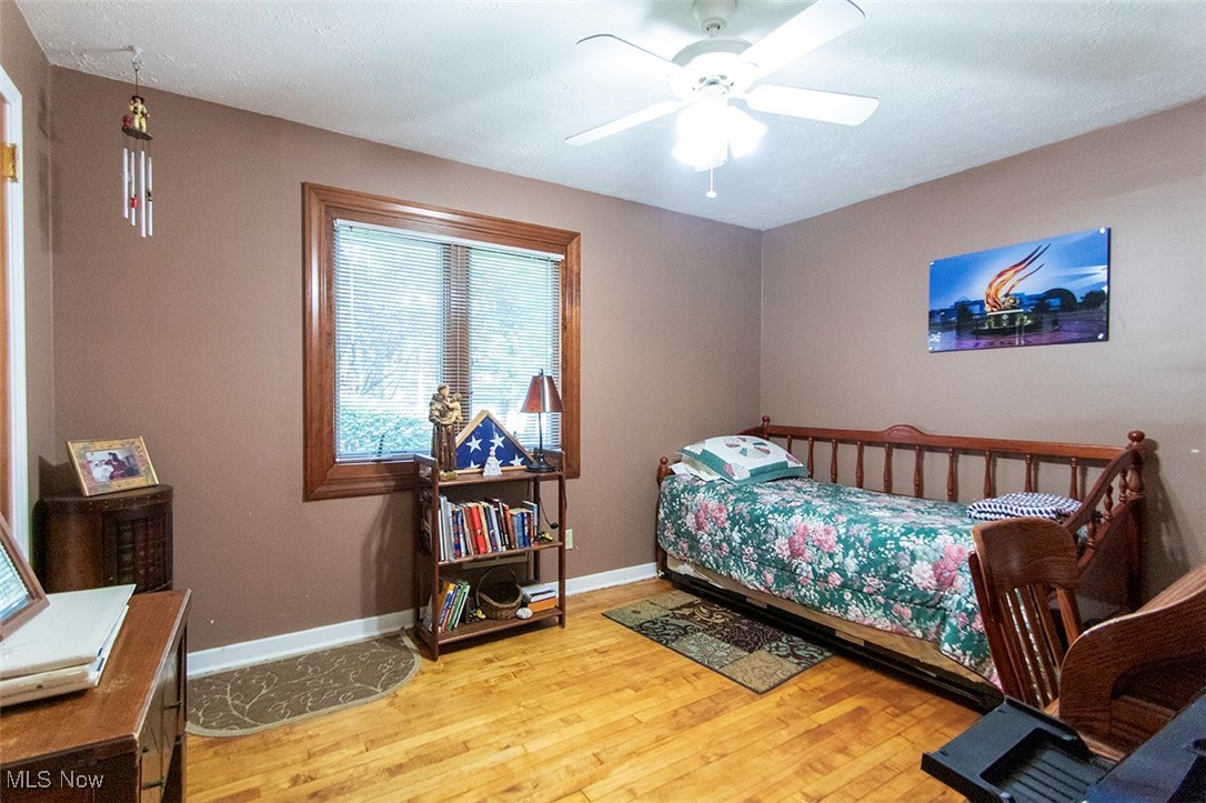 20749 Albion Road Strongsville, OH 44149 - Photo 22 of 35 Bedroom with wood finished floors, baseboards, and ceiling fan