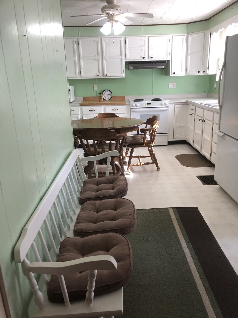 7968 South Sugar Island Road Chebanse, IL 60922 - Photo 17 of 39 a kitchen with stainless steel appliances kitchen island granite countertop a refrigerator a sink a stove and island