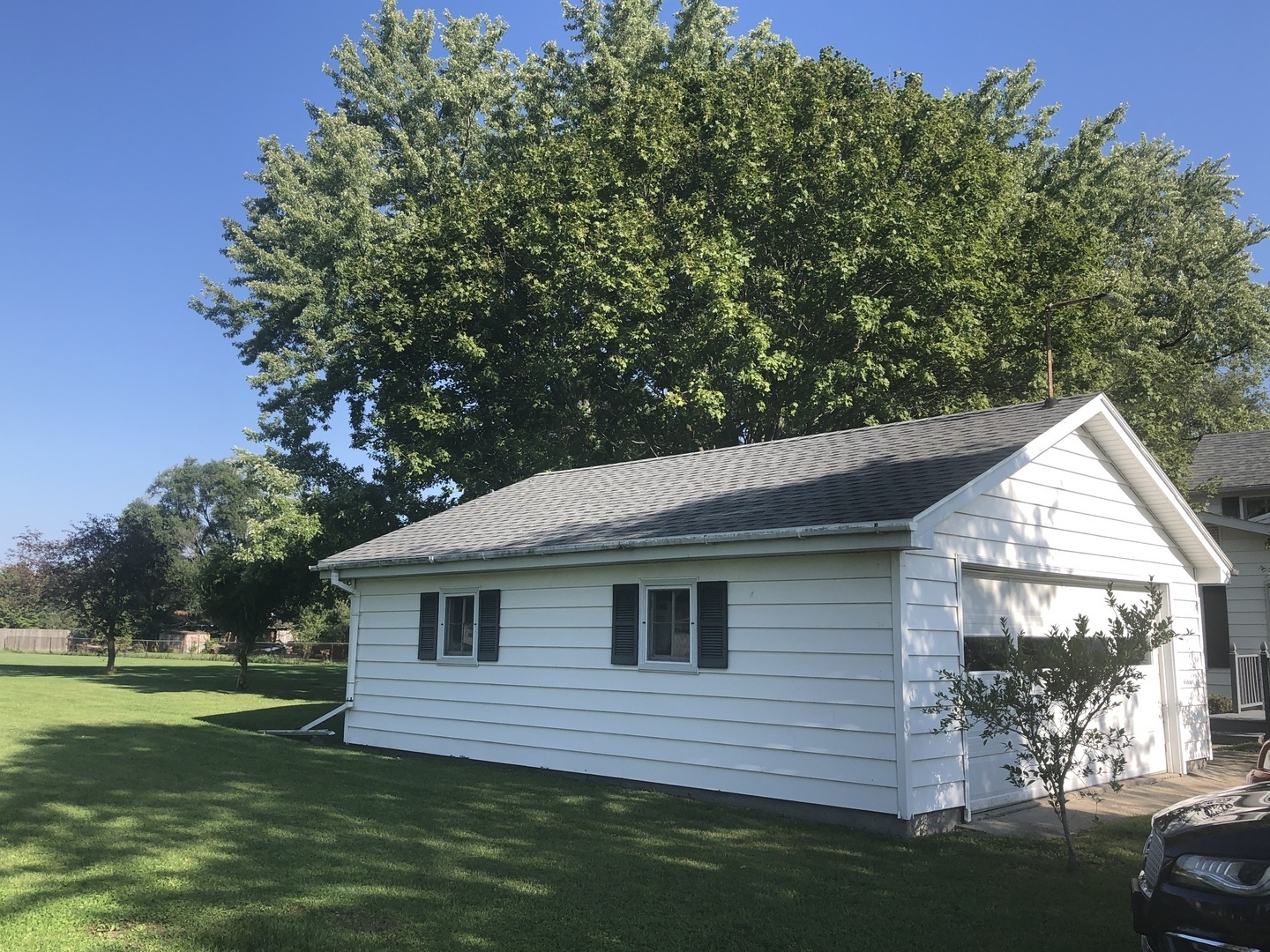 7968 South Sugar Island Road Chebanse, IL 60922 - Photo 9 of 39 a front view of a house with a garden