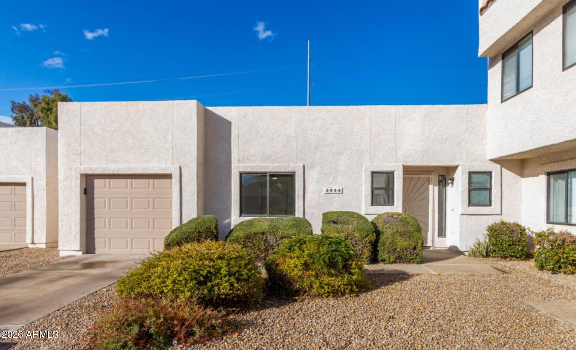2554 West Kathleen Road Phoenix, AZ 85023 - Photo 3 of 22 a view of a building with potted plants