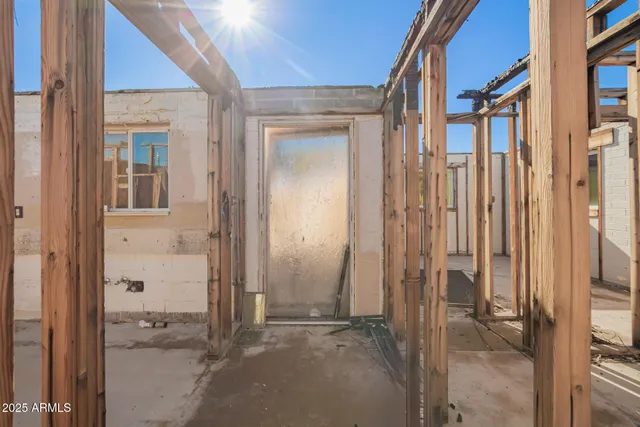 a view of a brick house with a glass door and shower