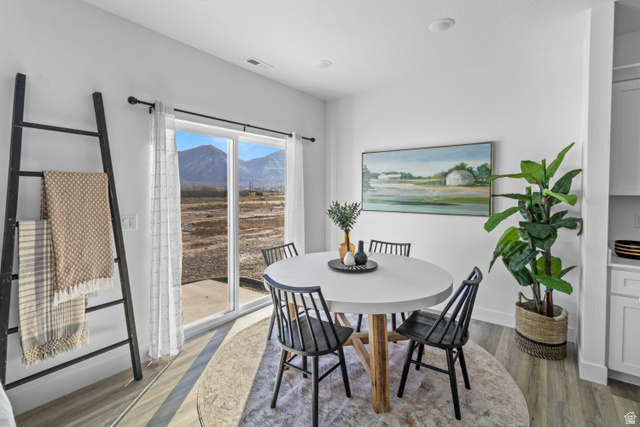 1264 West 500 South, Unit 320 Logan, UT 84321 - Photo 6 of 39 Dining area featuring wood-finish flooring, a sliding glass door, and recessed lighting
