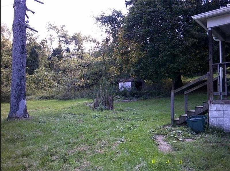 1746 Grange Road Charleroi, PA 15022 - Photo 5 of 11 a backyard of a house with lots of green space