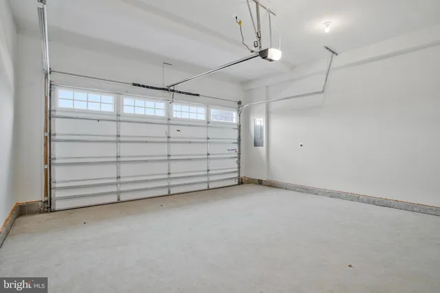 a bathroom with a toilet a sink a mirror a bathtub and vanity