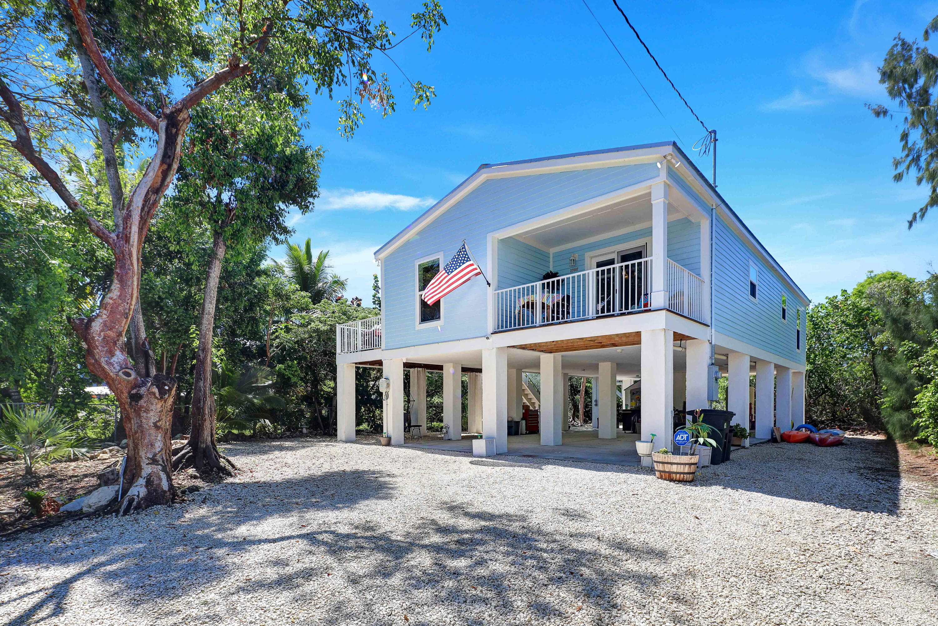27087 Angel Fish Road Summerland Key, FL 33042 - Photo 1 of 32 a front view of a house with a yard