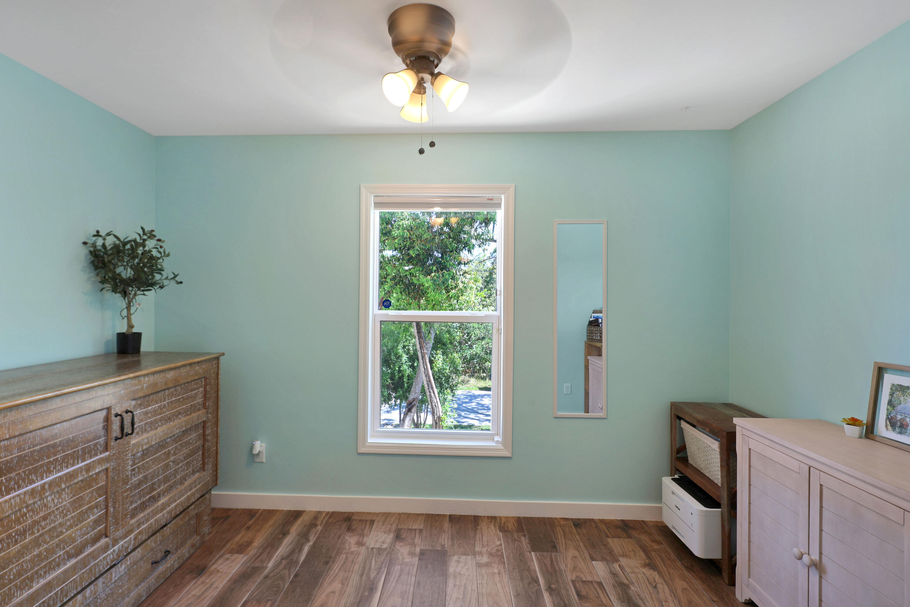 27087 Angel Fish Road Summerland Key, FL 33042 - Photo 11 of 32 a room with a window and a chandelier