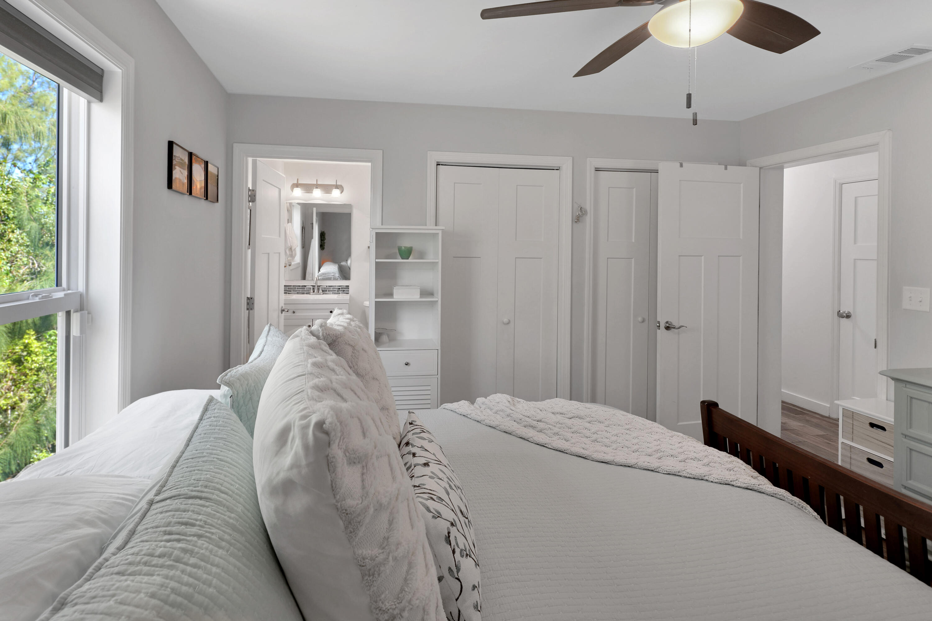 27087 Angel Fish Road Summerland Key, FL 33042 - Photo 20 of 32 a bed room with a bed and a chandelier
