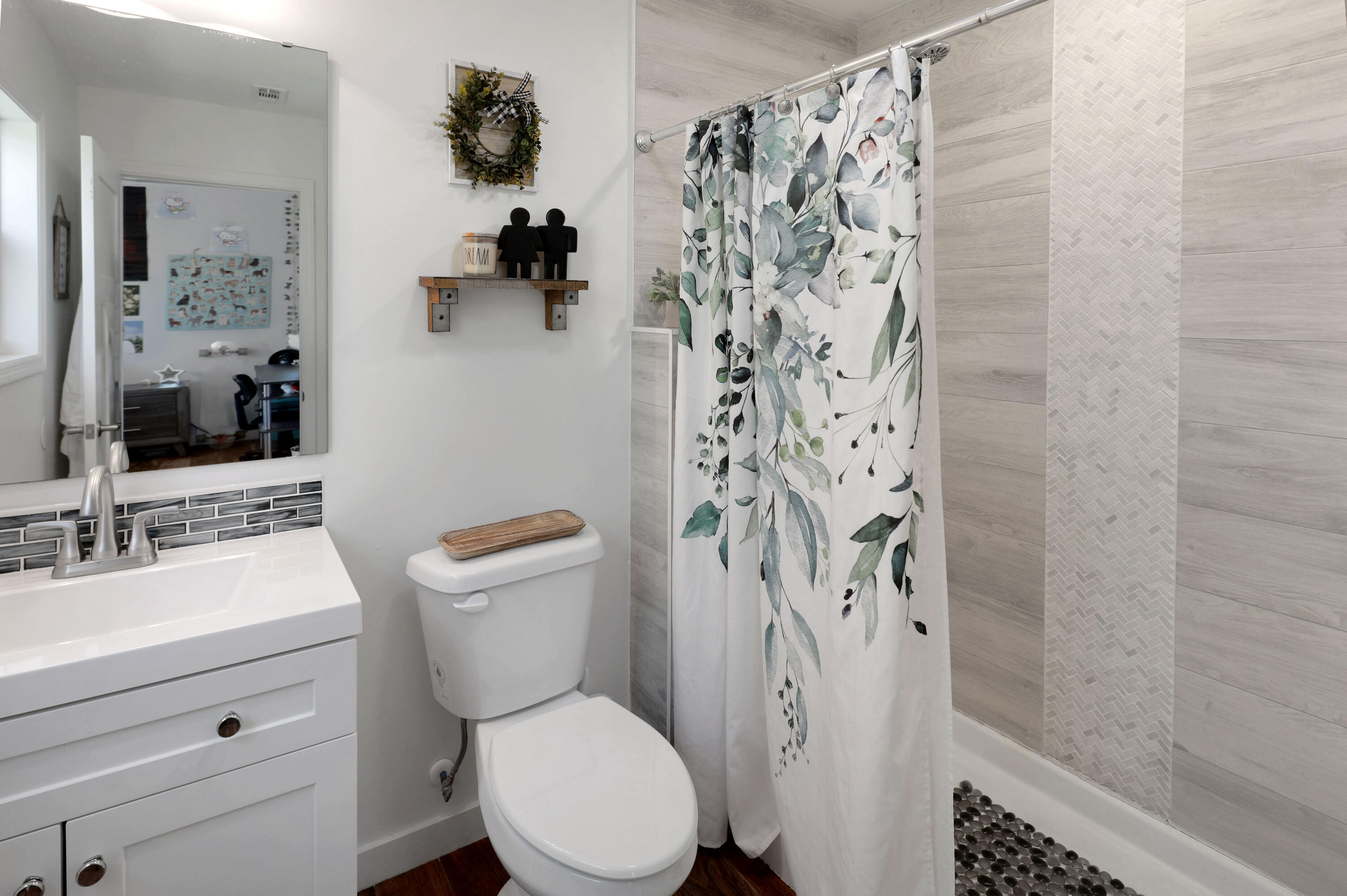 27087 Angel Fish Road Summerland Key, FL 33042 - Photo 21 of 32 a bathroom with a toilet sink and shower