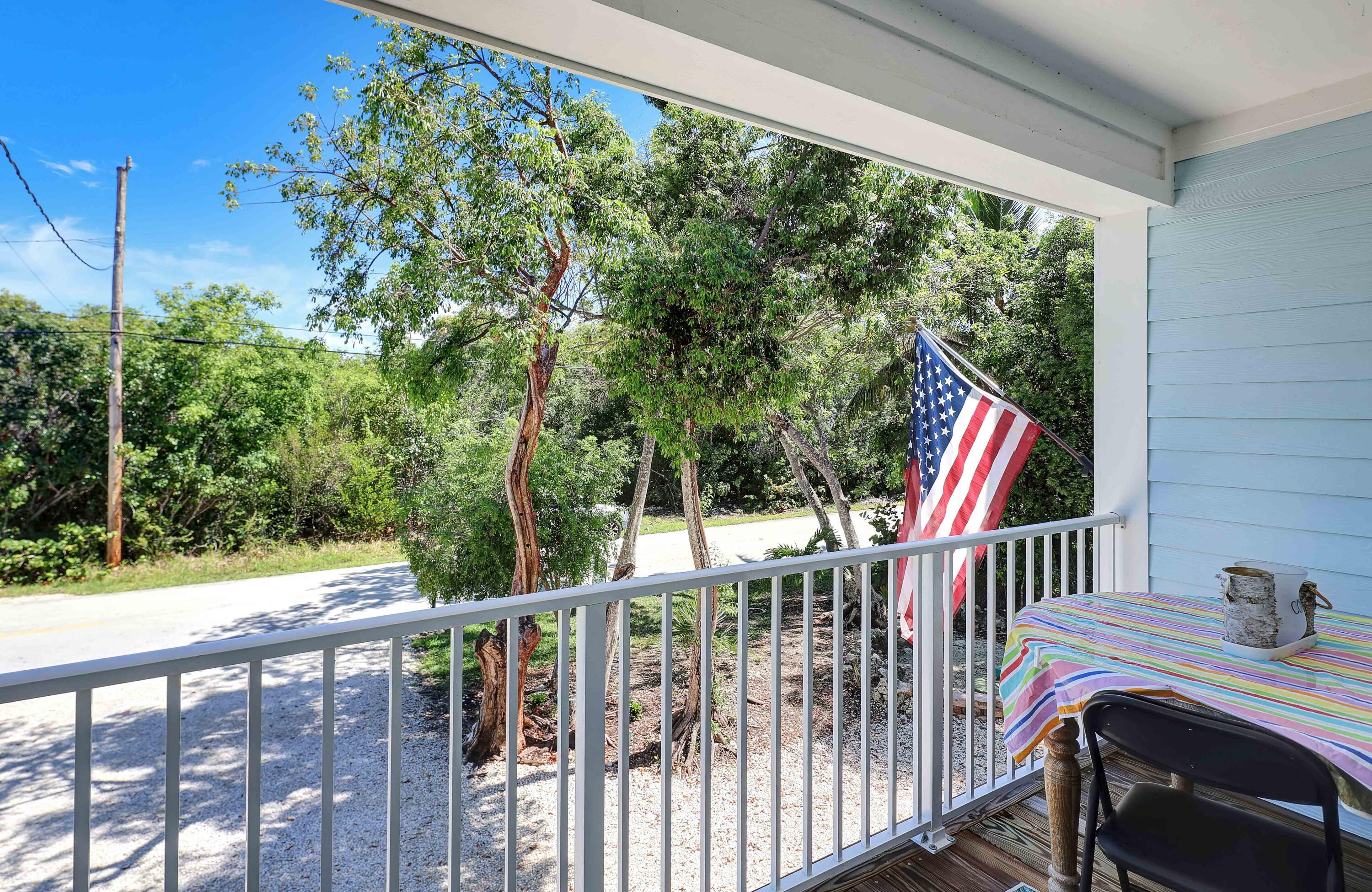 27087 Angel Fish Road Summerland Key, FL 33042 - Photo 25 of 32 a view of balcony with wooden floor and fence