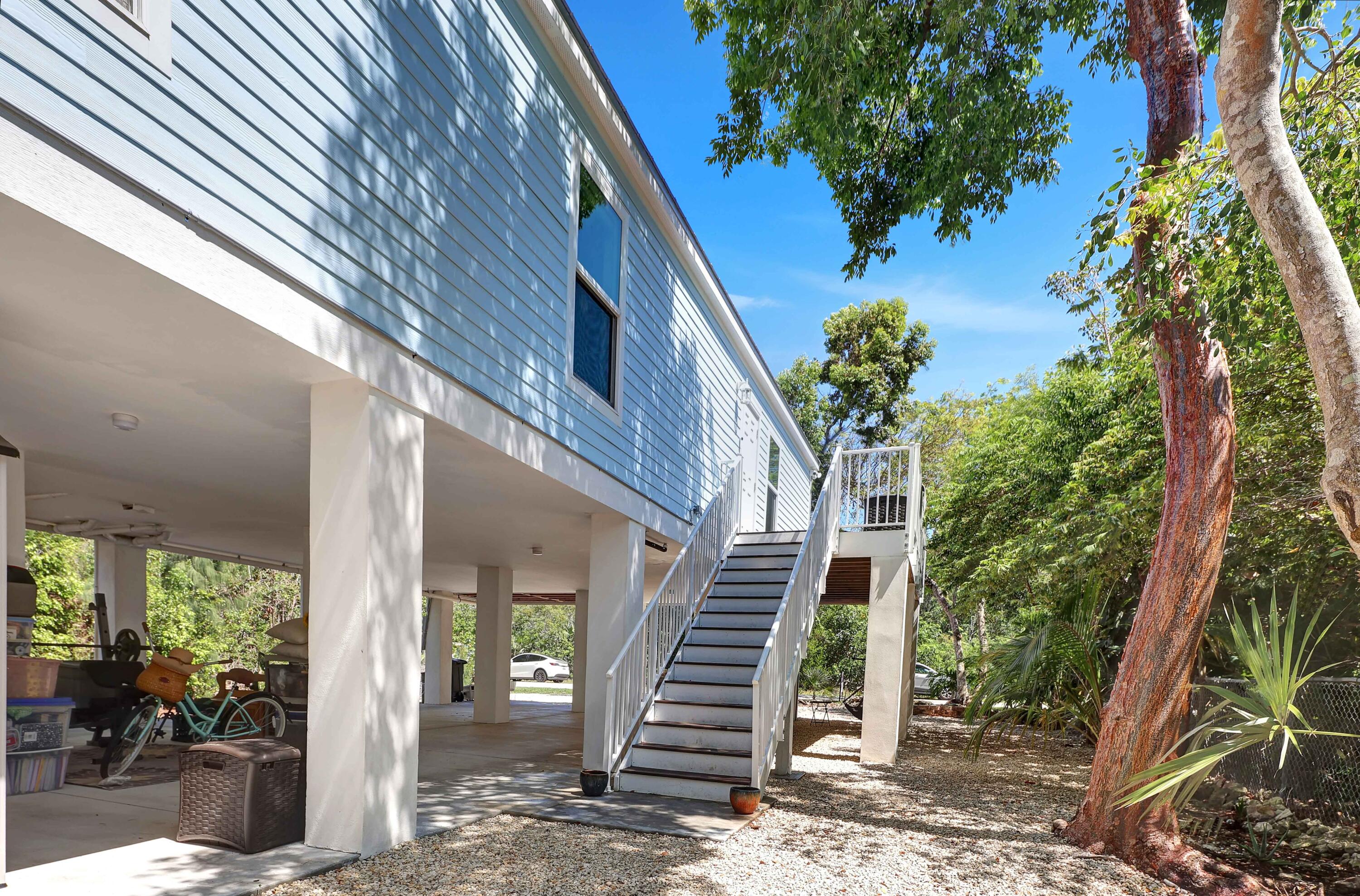 27087 Angel Fish Road Summerland Key, FL 33042 - Photo 27 of 32 a view of a house with a yard
