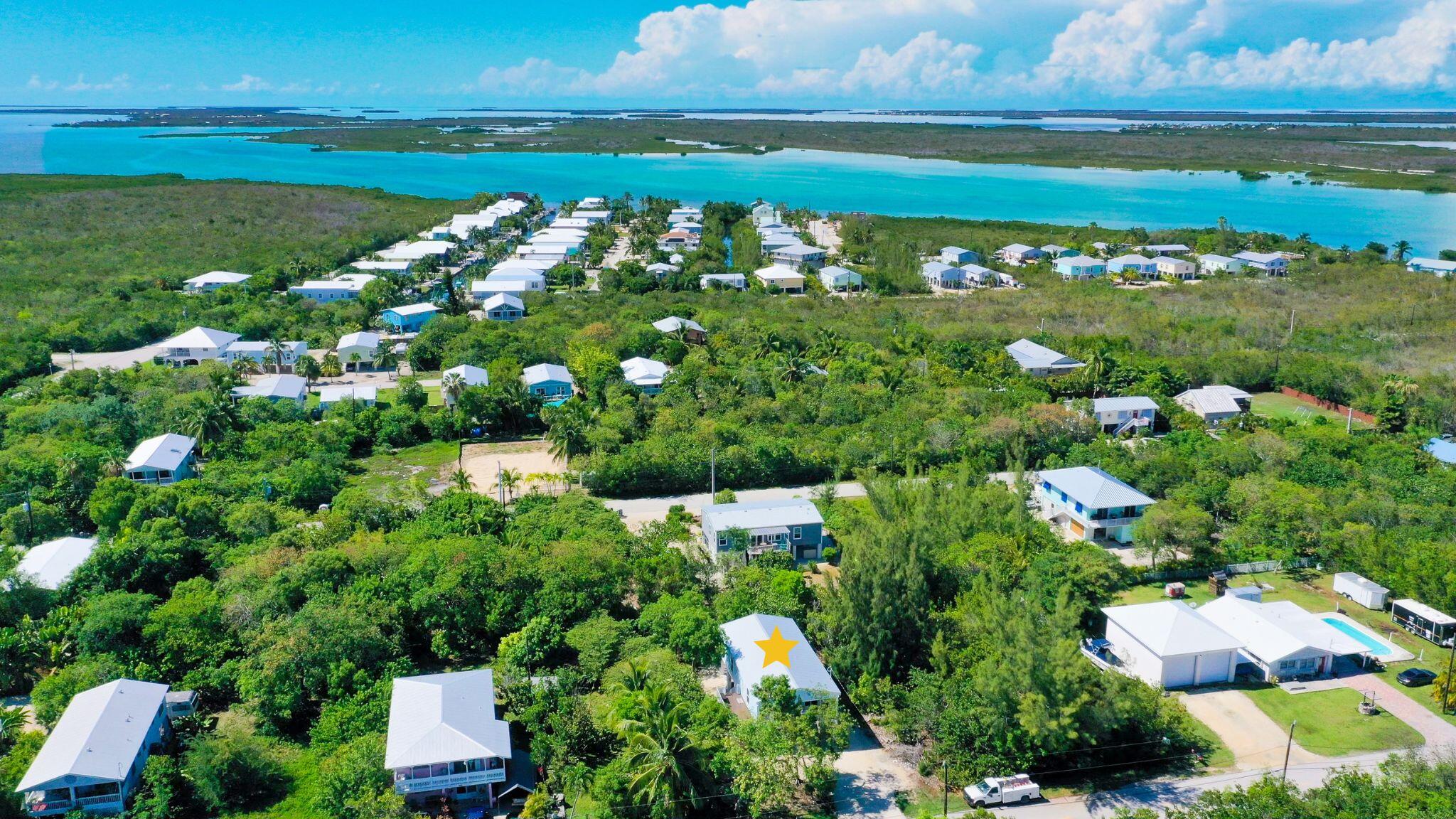 27087 Angel Fish Road Summerland Key, FL 33042 - Photo 4 of 32 a view of a lake with a city