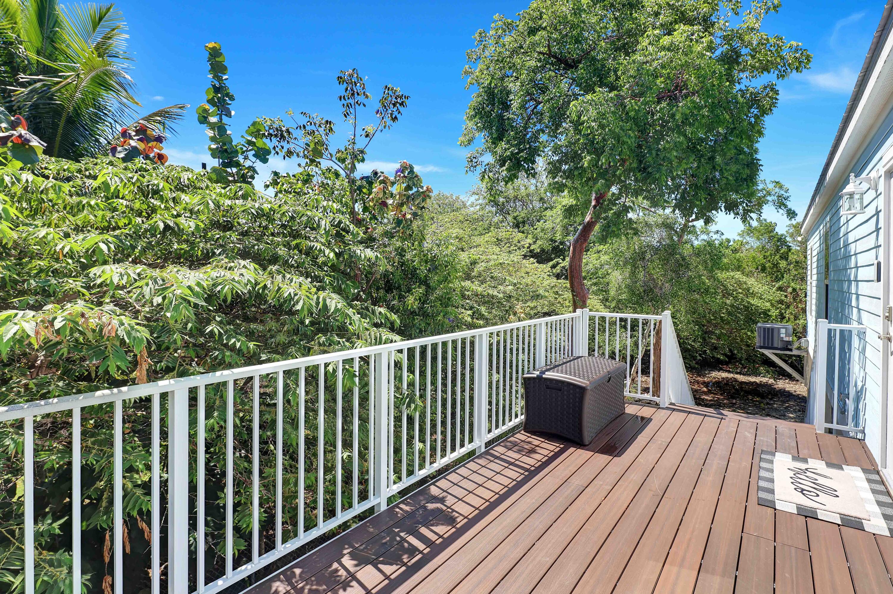 27087 Angel Fish Road Summerland Key, FL 33042 - Photo 5 of 32 a view of balcony with wooden floor and fence