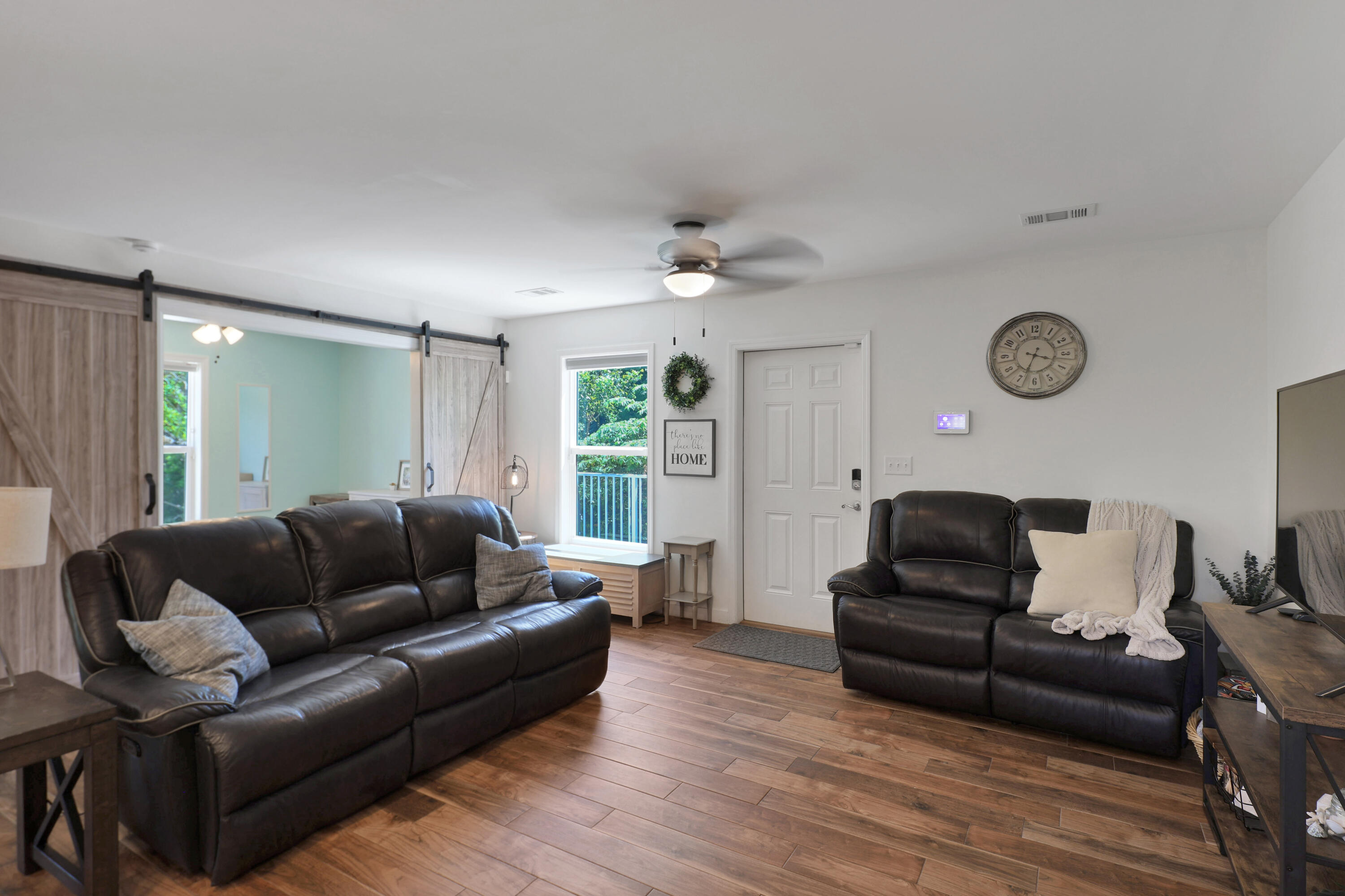 27087 Angel Fish Road Summerland Key, FL 33042 - Photo 10 of 32 a living room with furniture and a wooden floor
