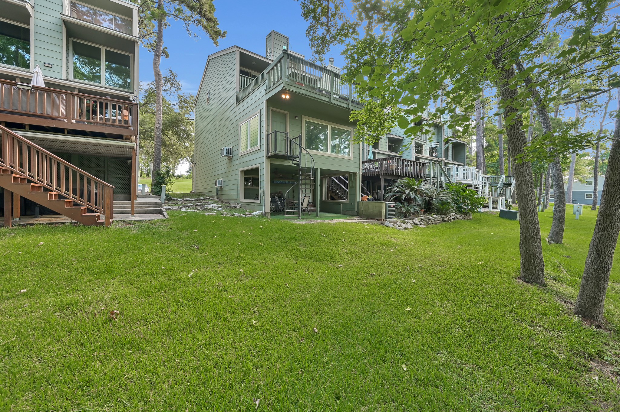 162 Villa Way Coldspring, TX 77331 - Photo 27 of 28 Rear exterior with Lake view/access