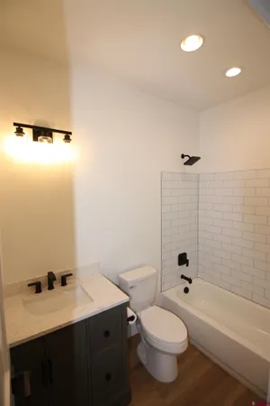 a bathroom with a sink a toilet and a bathtub