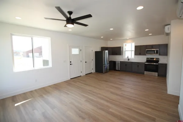 a view of a kitchen with a sink and a window