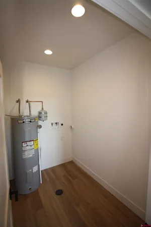 a view of a storage & utility room with a sink