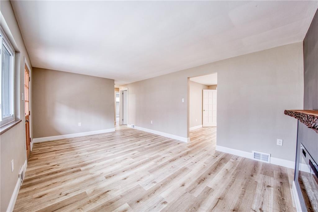 2158 Reis Run Road Pittsburgh, PA 15237 - Photo 11 of 50 a view of an empty room with wooden floor and a window
