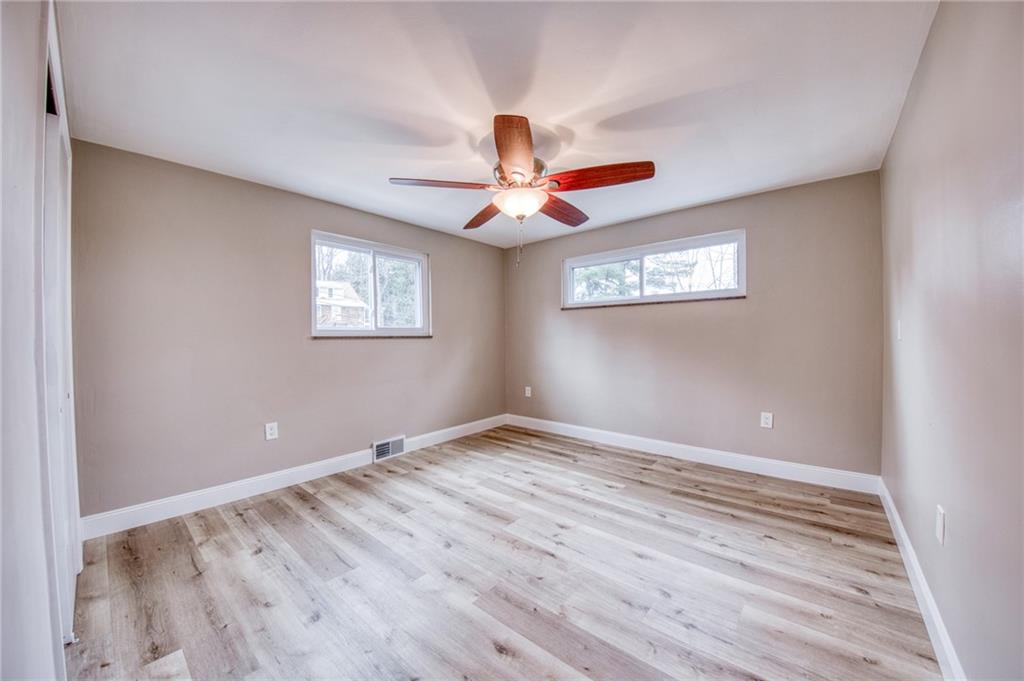 2158 Reis Run Road Pittsburgh, PA 15237 - Photo 12 of 50 a view of an empty room with window and a chandelier fan