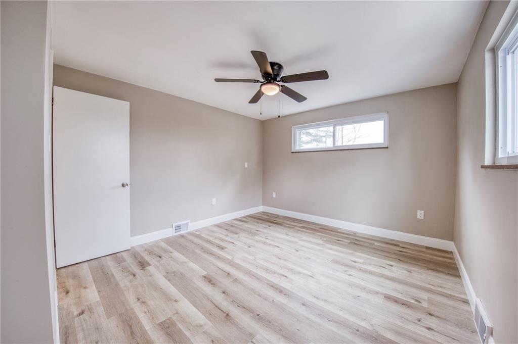 2158 Reis Run Road Pittsburgh, PA 15237 - Photo 19 of 50 wooden floor in an empty room with a window