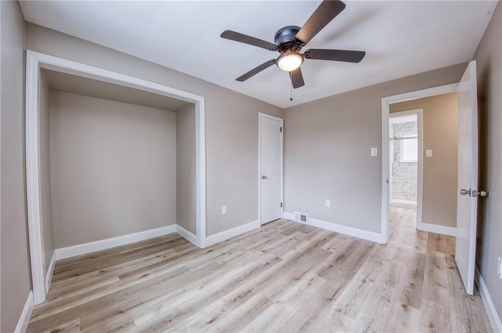 2158 Reis Run Road Pittsburgh, PA 15237 - Photo 21 of 50 a view of a big room with wooden floor and a ceiling fan
