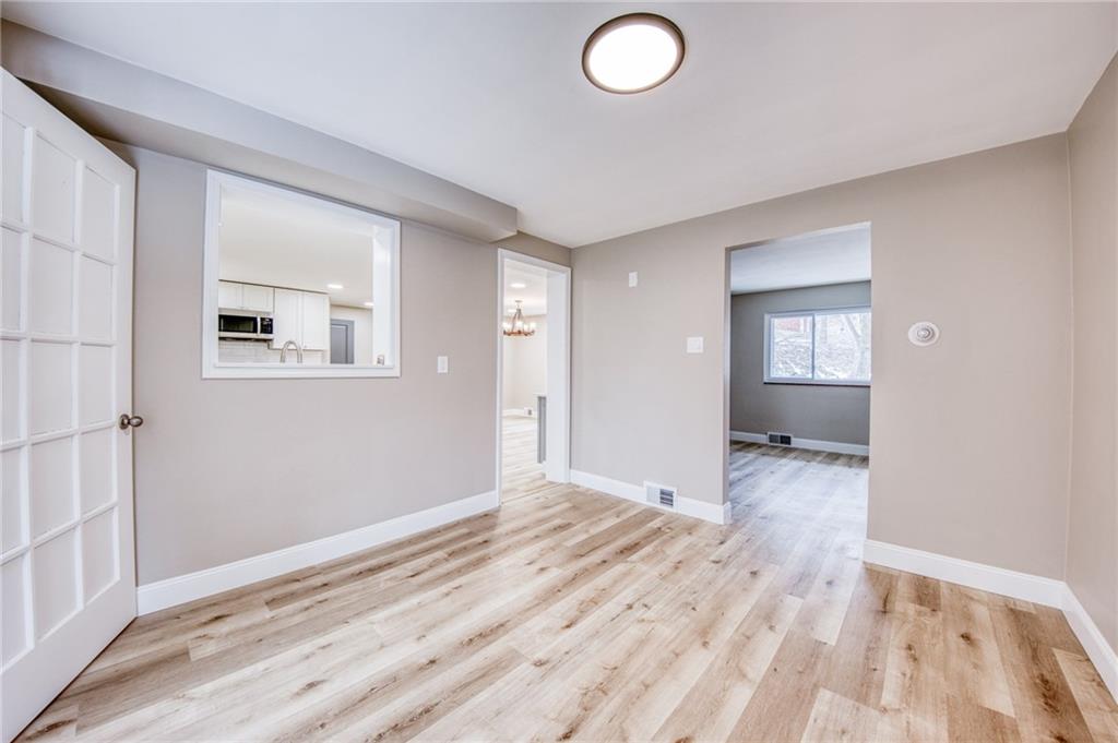 2158 Reis Run Road Pittsburgh, PA 15237 - Photo 28 of 50 an empty room with wooden floor and windows