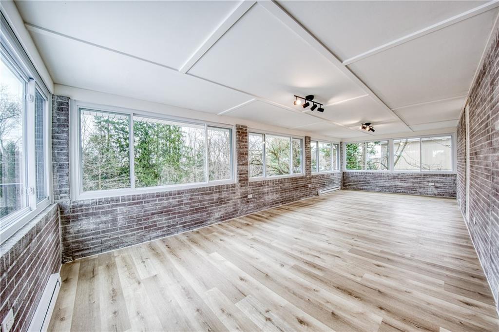 2158 Reis Run Road Pittsburgh, PA 15237 - Photo 29 of 50 a view of an empty room with wooden floor and a window
