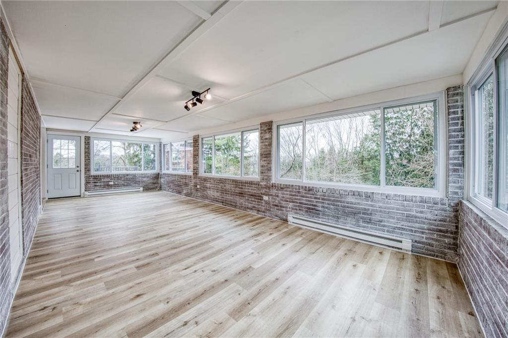 2158 Reis Run Road Pittsburgh, PA 15237 - Photo 32 of 50 an empty room with wooden floor and windows