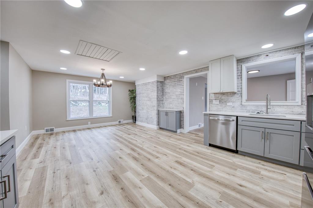 2158 Reis Run Road Pittsburgh, PA 15237 - Photo 35 of 50 a large kitchen with stainless steel appliances granite countertop a large counter top a sink and a refrigerator