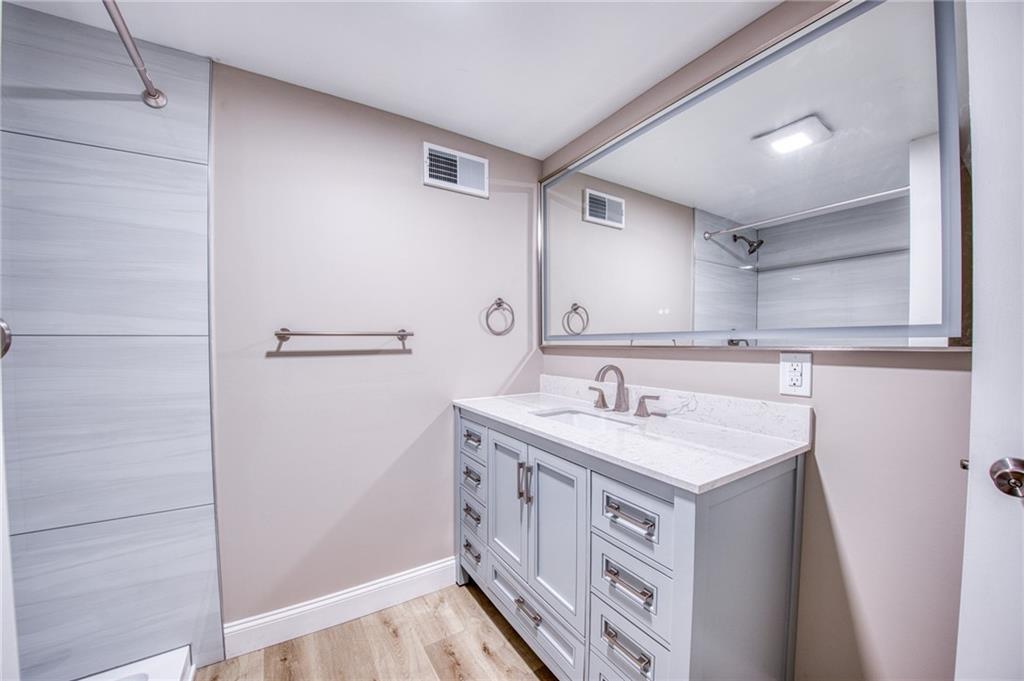 2158 Reis Run Road Pittsburgh, PA 15237 - Photo 47 of 50 a bathroom with a sink a vanity and a mirror