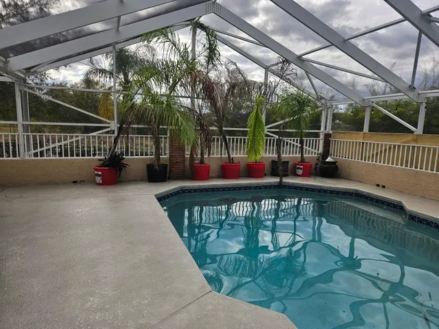 a kitchen with stainless steel appliances granite countertop a refrigerator and a stove