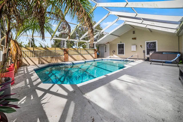 a living room with furniture and large windows