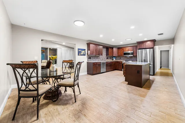 a bathroom with a sink vanity and a mirror