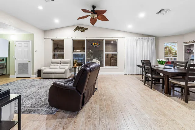 a backyard of a house with table and chairs