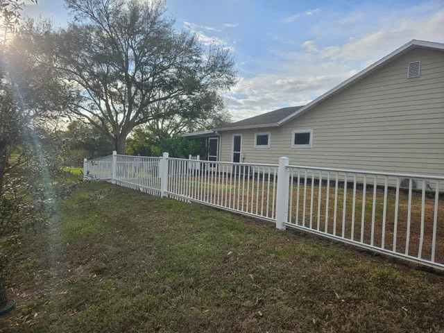 a view of a park with large trees