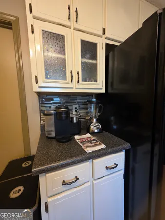 a kitchen with a stove and a microwave