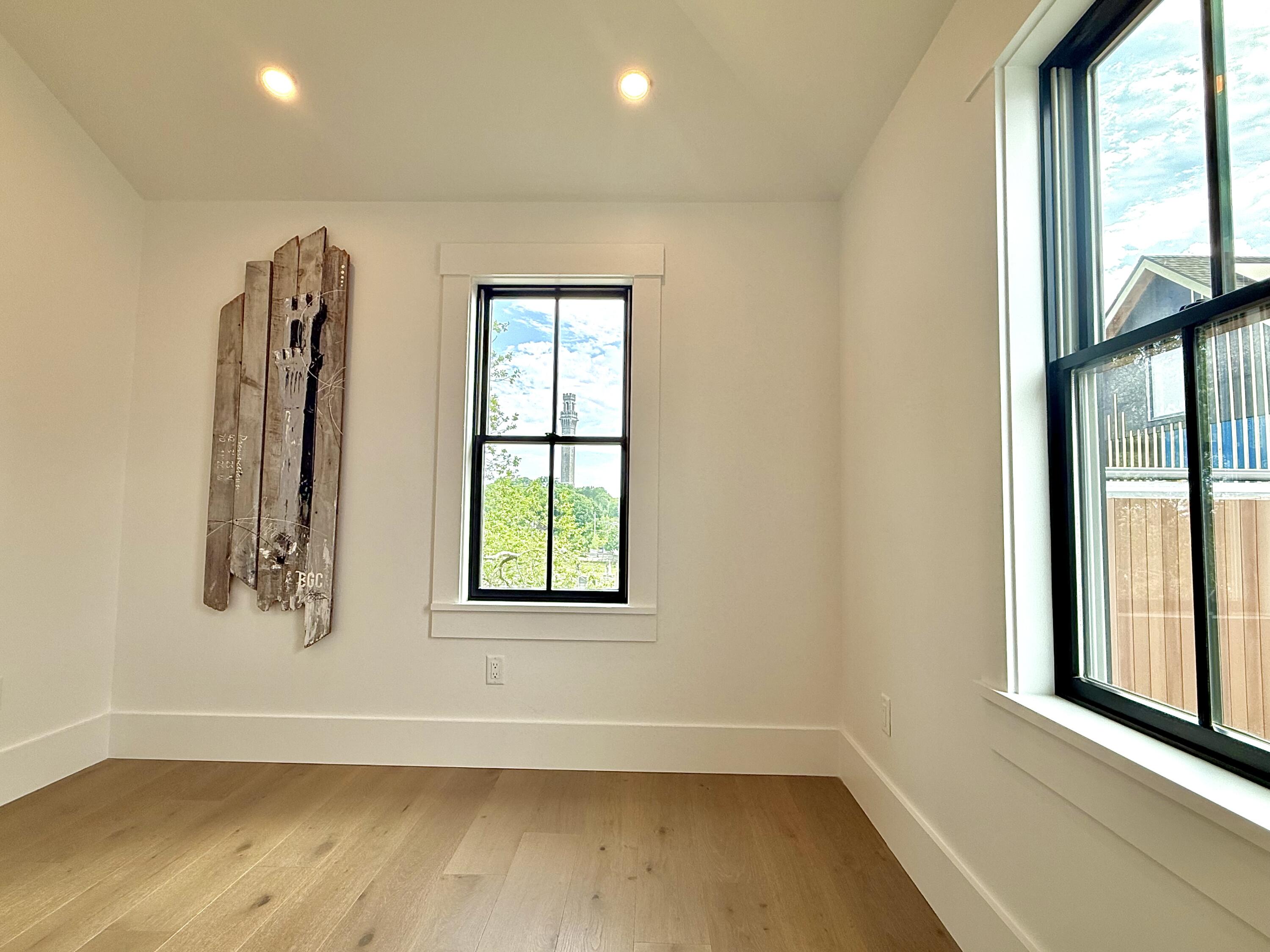 29 Cemetery Road, Unit 2 Provincetown, MA 02657 - Photo 28 of 30 an empty room with windows