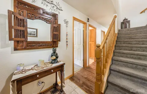 a view of a hallway with staircase