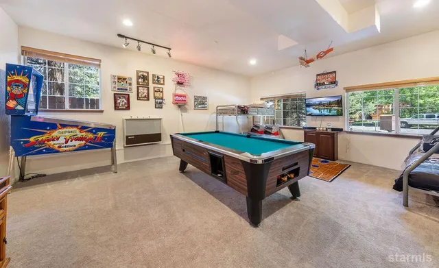a room with furniture and pool table