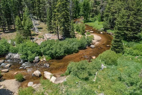 a view of a houses with a mountain view