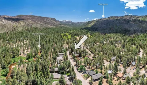 a view of a two chairs in the balcony