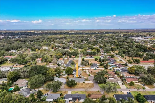 a kitchen with a stove a sink a refrigerator and cabinets