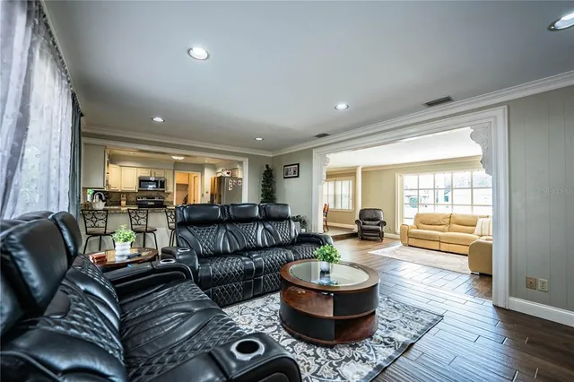 a room with wooden floor and furniture