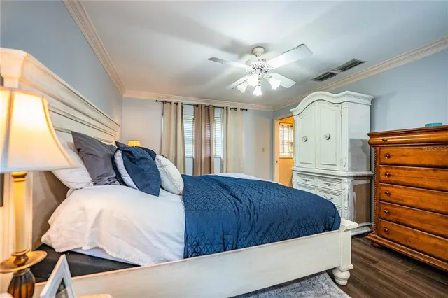 a bedroom with a bed and a lamp