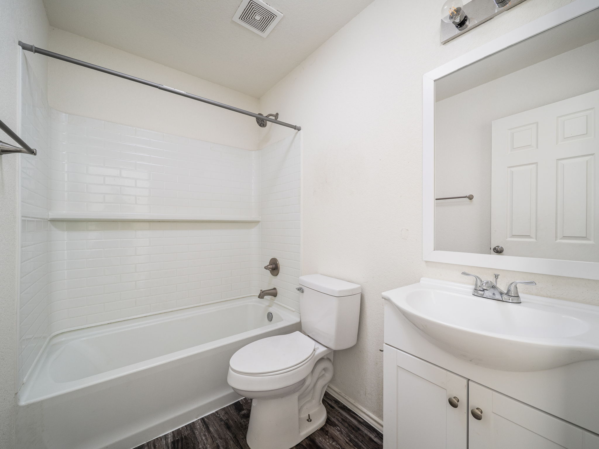 230 Debus Drive, Unit 108B Taylor, TX 76574 - Photo 12 of 16 Full bathroom with vanity, bathtub / shower combination, and wood finished floors