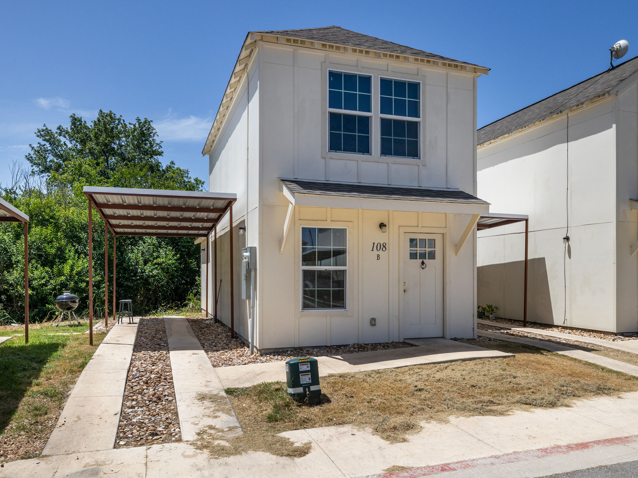 230 Debus Drive, Unit 108B Taylor, TX 76574 - Photo 2 of 16 View of front of house with board and batten siding