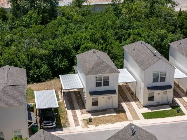 an aerial view of a house with yard patio and livingroom view